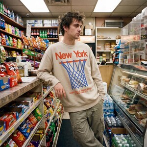 Retro New York Knicks streetwear basketball sweatshirt, oversized beige off white heavyweight sweater with royal blue and orange NY bball graphic for men and women