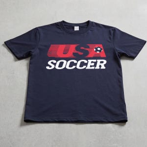 USMNT USWNT World Cup 2026 vintage 80s style graphic t-shirt, unisex 90s throwback United States navy blue, red, and white graphic tee shirt