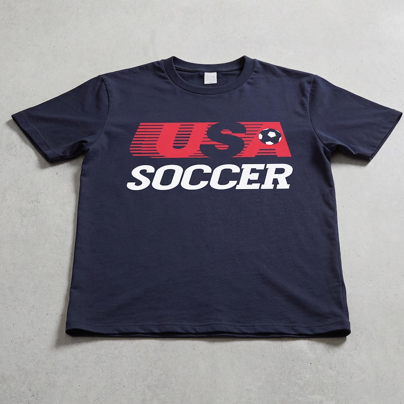 USMNT USWNT World Cup 2026 vintage 80s style graphic t-shirt, unisex 90s throwback United States navy blue, red, and white graphic tee shirt