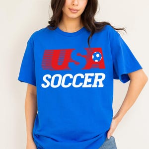 USMNT USWNT World Cup 2026 vintage 80s style graphic t-shirt, unisex 90s throwback United States royal blue, red, and white graphic tee shirt