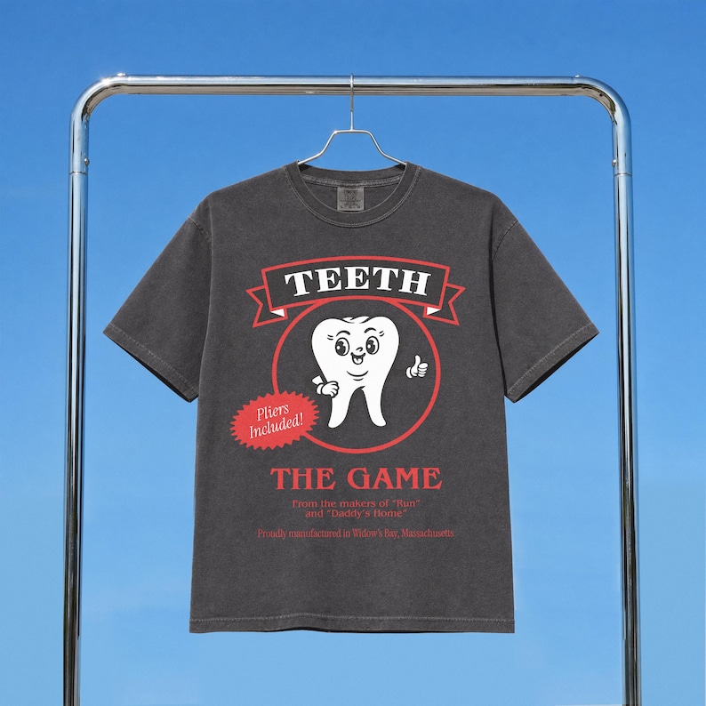 Funny Widow's Bay tv show t-shirt with Teeth board game graphic on a unisex washed black comfort colors graphic tee
