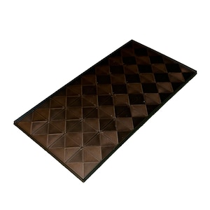 May include: A rectangular, dark brown decorative panel with a repeating diamond pattern. The panel has a raised, textured surface and a black border. The design creates a geometric, three-dimensional effect.