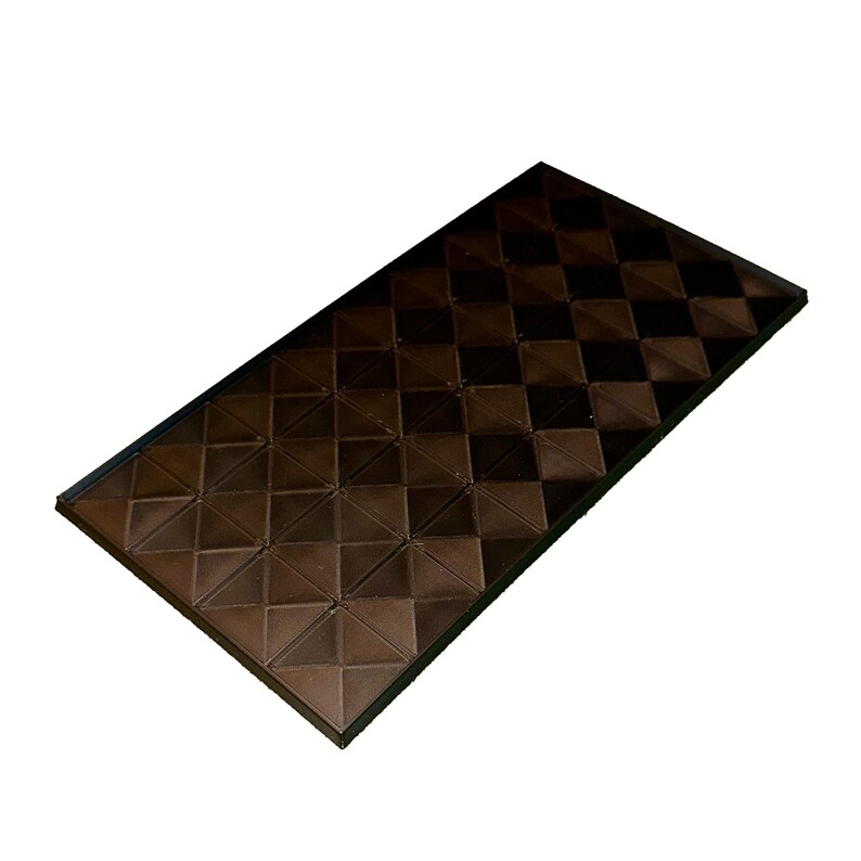 May include: A rectangular, dark brown decorative panel with a repeating diamond pattern. The panel has a raised, textured surface and a black border. The design creates a geometric, three-dimensional effect.