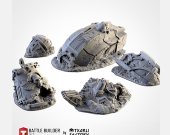 May include: Five gray, miniature, battle-damaged vehicle models. The models are in various states of disrepair, with cracked surfaces and exposed internal components. The models are set on a textured base, suggesting a post-apocalyptic or war-torn environment. The text "BATTLE BUILDER tech" and "by TXARLI FACTORY" are visible.