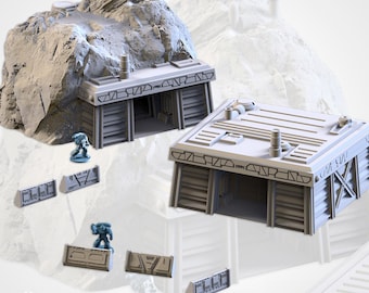 May include: A gray, 3D-printed model of a futuristic bunker or building, set against a rocky terrain. The model features detailed architectural elements, including a sloped roof, ventilation pipes, and a recessed entrance. Miniature figures and additional wall sections are also present.