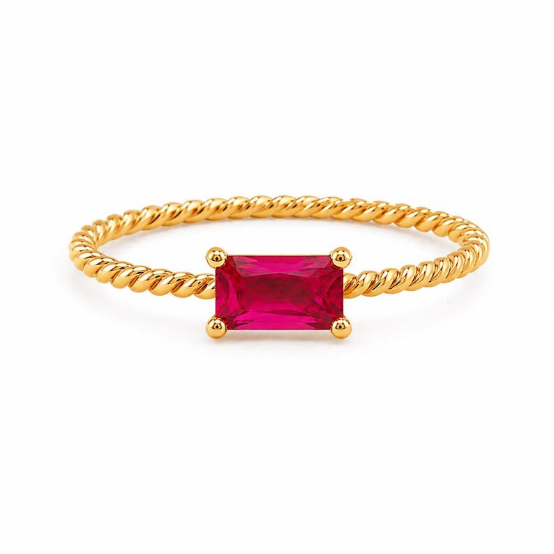 925 Sterling Silver Gold Plated Ruby gemstone ring with twisted gold band, four-prong setting, centered on a clean white surface.