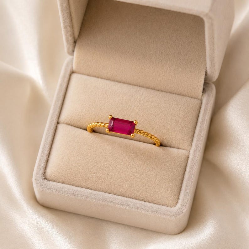 925 Sterling Silver Gold Plated Ruby gemstone ring with twisted gold band presented inside a soft beige jewelry ring box.