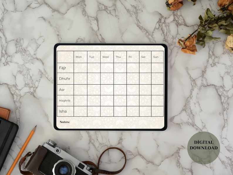 May include: Digital download of a daily prayer tracker on a tablet. The tracker has sections for Fajr, Dhuhr, Asr, Maghrib, and Isha, with days of the week across the top. The background is a marble pattern.