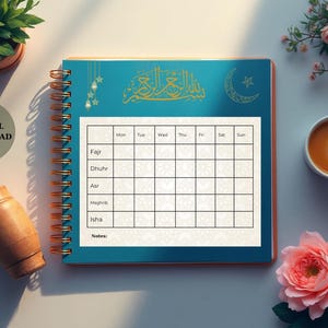May include: A teal spiral-bound notebook with a gold design and a blank weekly schedule. The notebook is open to a page with a grid for daily entries. A cup of coffee, a rose, and a small plant are also visible.
