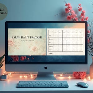 May include: A computer monitor displays a "Salah Habit Tracker" digital download. The screen shows a floral design with a daily prayer schedule. A keyboard, mouse, and decorative flowers are in the foreground. The words "Digital Download" are in the upper left corner.