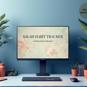 May include: A computer monitor displays a "Salah Habit Tracker" with floral accents. The scene includes plants in blue vases, a keyboard, mouse, and a digital download icon, all set against a blue backdrop. A simple guide to daily salah.