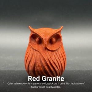 May include: A small, red granite-colored owl figurine with a textured, layered surface finish. The owl features prominent ear tufts, circular eyes, and stylized wing feathers. The text 'Red Granite' is printed below the owl figure.