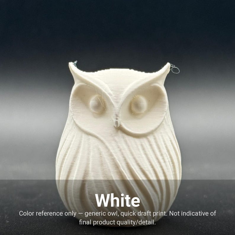 May include: A white 3D printed owl figurine with a smooth, layered texture and prominent circular eyes. The base of the owl features a swirling, feather-like pattern. The text "White" is printed at the bottom, followed by "Color reference only &mdash; generic owl, quick draft print. Not indicative of final product quality/detail."