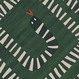May include: A green rug featuring a black and white snake motif. The snake has a red tongue. The rug's design includes a repeating pattern of white rectangles surrounding the snake.