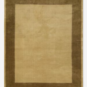 May include: A rectangular rug featuring a light tan central area framed by a darker brown border. The rug's design is simple and elegant, suitable for various interior styles. The border defines the central area, creating a clear visual structure.