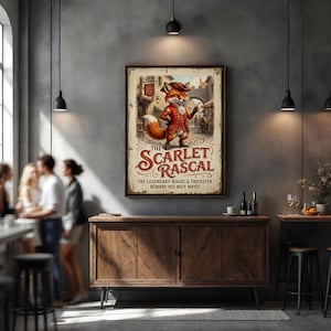May include: A framed vintage-style poster featuring a cartoon fox in a red coat and tricorn hat. The poster reads "The Scarlet Rascals" with the tagline "The Legendary Rogue & Trickster Beware His Wily Ways!" The poster is displayed above a wooden cabinet.
