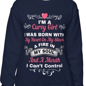 May include: Navy blue sweatshirt with the text "I'M A Curvy Girl" and other phrases in white script. A pink heart is above the text. The sweatshirt is a casual style.