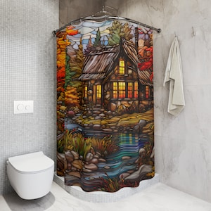 May include: A stained glass style shower curtain featuring a stone cottage with lit windows, surrounded by trees and a flowing stream. The cottage has a brown roof and stone walls. The stream is blue and green and has rocks in it.