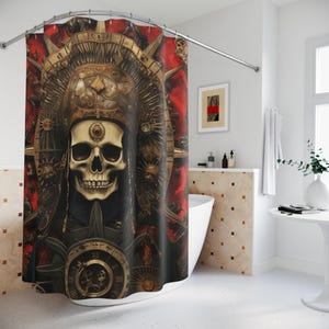 May include: A shower curtain featuring a detailed illustration of a skull wearing an ornate headdress. The design incorporates elements of gold, red, and black, with a clock-like emblem at the bottom. The overall theme is gothic and macabre.