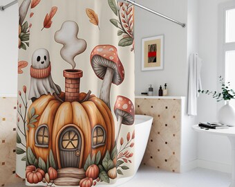 May include: A whimsical shower curtain featuring a pumpkin house with a chimney, a friendly ghost wearing a scarf, and mushrooms. The design includes autumn leaves and pumpkins in shades of orange, brown, and beige. The curtain is designed to fit a standard shower rod.