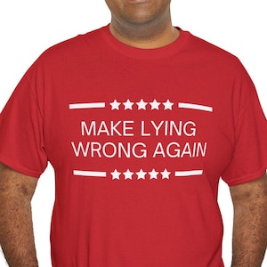 May include: Red t-shirt with white text that reads "MAKE LYING WRONG AGAIN" with stars above and below the text.