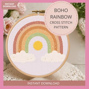May include: A cross-stitch pattern in a wooden hoop features a boho rainbow design with a yellow sun and white clouds. The text "BOHO RAINBOW CROSS STITCH PATTERN" is in a circle. The words "INSTANT DOWNLOAD" appear at the top and bottom.