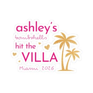 May include: A die-cut sticker featuring the hot pink text ashley's bombshells hit the VILLA Miami 2026. The design includes small gold glitter hearts and two gold glitter palm trees on the right side, all set against a plain white background.
