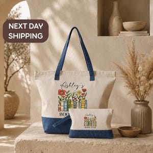 a large tote bag with a floral design and the name "Ashley's Book Club" printed on it, along with a smaller bag below it. The bags are placed on a table, and there is a vase of flowers and a bowl nearby. The background includes a bookshelf and a sign that says "Next day shipping".
