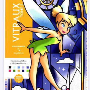 May include: A Disney-branded coloring book titled "VITRAUX TOME 2" featuring Tinkerbell in a stained-glass style design. The cover has a yellow vertical stripe with text and a color palette. The book's theme is coloring by numbers to reveal hidden images.