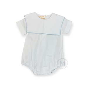 May include: White baby onesie with a blue trim around the collar and sleeves. The onesie has a large, white collar with a blue trim. The onesie has the text "Sir John" on the front.