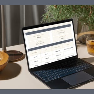 May include: A black laptop displaying a digital leadership and management template with fields for staff rosters, assignments, and contact information. The screen shows organized tables with headers and placeholders for names, roles, and specific table duties.