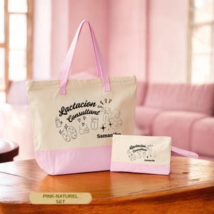May include: A cream and pink canvas tote bag and a matching smaller zippered pouch. Both items feature black line art graphics of a nursing pillow, bottle, breast pump, and the text "Lactacion Consultant" along with the name "Samantha".