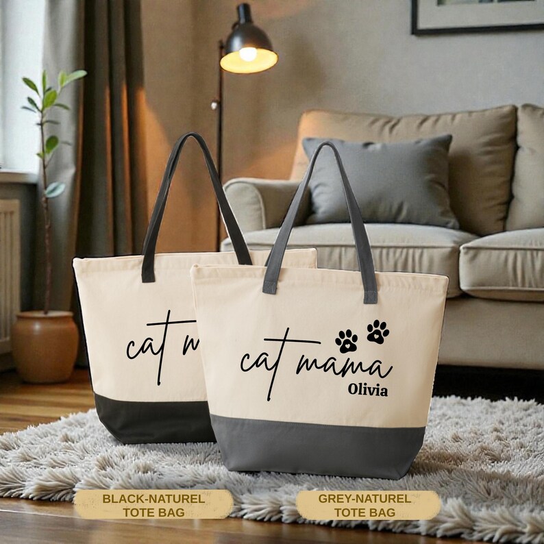 Two tote bags with the text "cat mama Olivia" printed on them, placed on a rug in a living room setting.