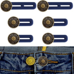 May include: A collection of six navy blue jean button extenders with brass-colored metal buttons. The buttons are embossed with the word "JEANS" and other text. The bottom of the image shows a pair of blue jeans with a button.
