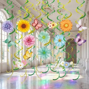 May include: A set of hanging party decorations featuring green and yellow spiral streamers adorned with various colorful paper flowers and butterflies in shades of purple, yellow, pink, orange, and blue, designed for ceiling suspension.