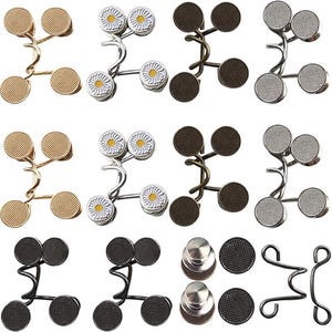 May include: Assortment of metal button extenders in various styles. Includes gold, silver, and black extenders with round, textured button faces. Some feature daisy designs. These extenders are designed to add extra room to pants and skirts.