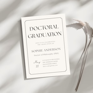 May include: An ivory-coloured Doctoral Graduation announcement with black text. The invitation includes the text "DOCTORAL GRADUATION" and details for Sophie Anderson's graduation, including the date, time, and location. A sprig of dried flowers rests on the right.