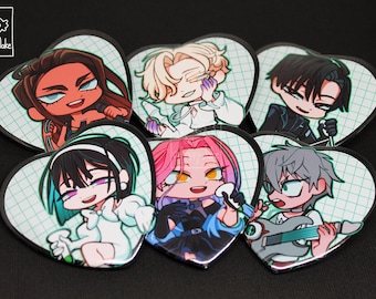 May include: Six heart-shaped pins featuring chibi-style anime characters with diverse hair colors and outfits, set against a light green grid background. Each pin displays a unique character, including one holding a guitar, all with black borders.