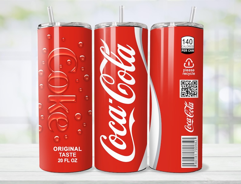 May include: A red 20 fl oz tumbler with a Coca-Cola design. The tumbler features the Coca-Cola logo in white, the word "Coke" in a stylized font, and the text "Original Taste". It also includes a straw and a "please recycle" label.