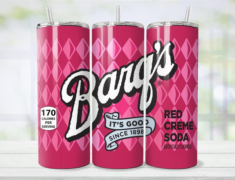 May include: A red and pink insulated tumbler with a straw, featuring the Barq's logo in white. The design includes a diamond pattern and the text "Red Creme Soda". It also displays "170 Calories Per Serving" and "It's Good Since 1898".
