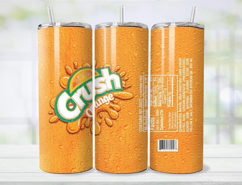 May include: Orange-colored tumbler with the "Crush Orange" logo and a straw. The tumbler has a condensation effect, and the nutrition facts and ingredients are visible on the side. The tumbler is designed to keep drinks cold.