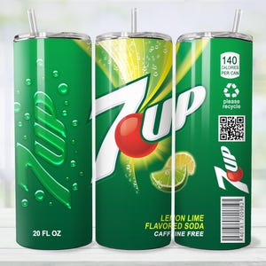 May include: A green 20 fl oz tumbler featuring the 7 Up logo with a red dot and lemon slices. The tumbler has a straw and includes the text "Lemon Lime Flavored Soda Caffeine Free". It also has a "Please Recycle" symbol.