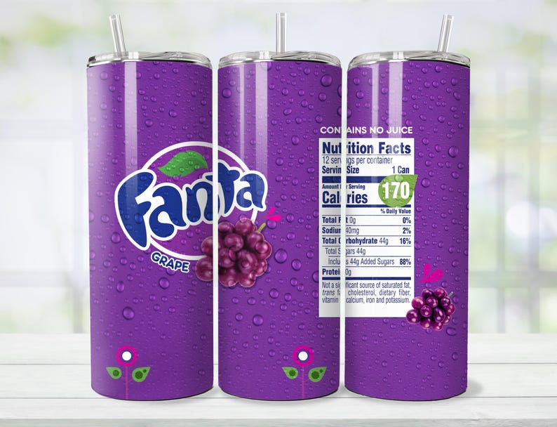 May include: A purple tumbler with a straw, featuring the Fanta Grape logo and a cluster of grapes. The design includes water droplets and a nutrition facts label. The tumbler is designed to hold beverages.
