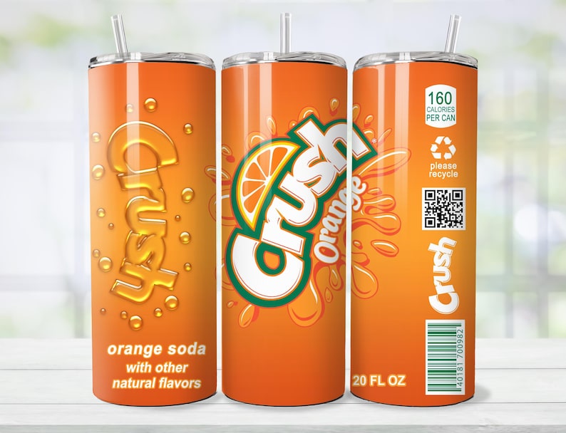May include: Orange Crush soda tumbler with a straw. The tumbler features the Crush logo and orange slice graphic. The text on the tumbler reads "orange soda with other natural flavors" and "20 FL OZ". The tumbler also includes a recycling symbol and a barcode.
