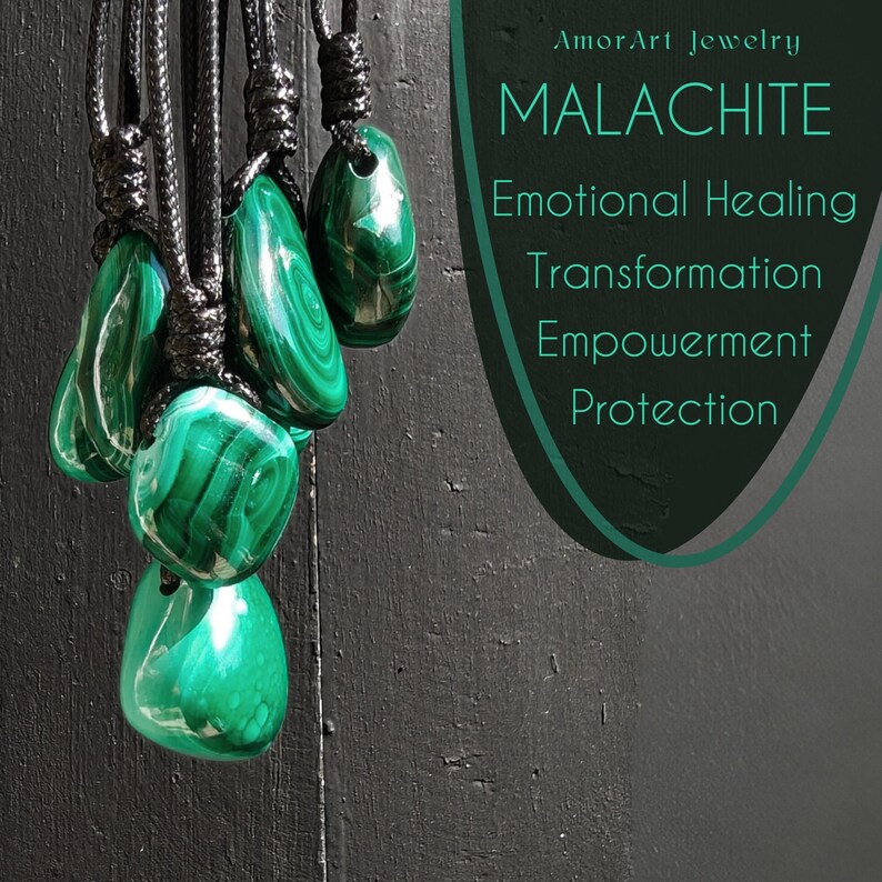 Close-up of multiple polished irregular Malachite in shades of vivid green and deep forest green, hanging against a dark textured wooden background. The green opaque gemstones have smooth glossy surfaces with distinct banded patterns, concentric rings, and flowing lines, with varied shapes and layered green formations visible. It is attached to a black cord with a top knot and adjustable knot closure. The image includes the text Malachite Emotional Healing Transformation Empowerment Protection.