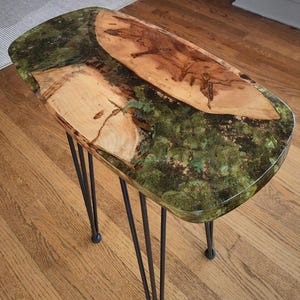 May include: A set of three ceramic mugs with a speckled, matte finish. The mugs are in shades of cream, light gray, and dark gray. Each mug has a simple, modern design and a rounded handle.