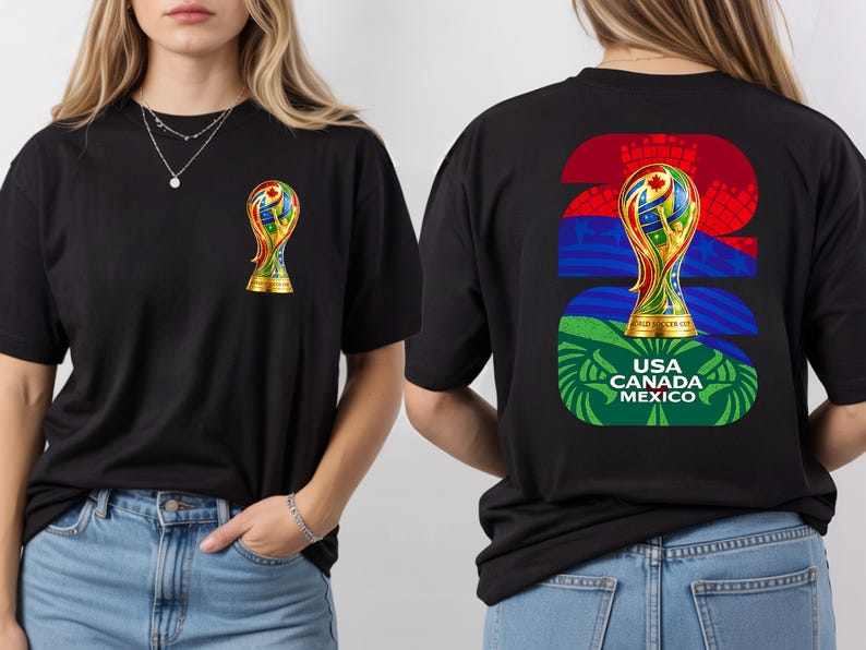 May include: Black t-shirt featuring a colorful trophy design on the front and back. The back of the shirt displays the number 22, a trophy graphic, and the text "USA CANADA MEXICO". The front of the shirt has a smaller trophy graphic.