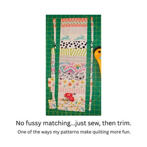 May include: A patchwork of colorful fabric strips, featuring patterns like bunnies, polka dots, and florals, are arranged on a green cutting mat. A yellow rotary cutter is visible. Text reads: "No fussy matching...just sew, then trim."