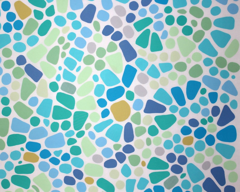 May include: Abstract pattern featuring a mosaic of irregular shapes and circles in shades of blue, green, gray, and yellow against a white background. The design is reminiscent of a pebble mosaic or a stylized natural landscape.
