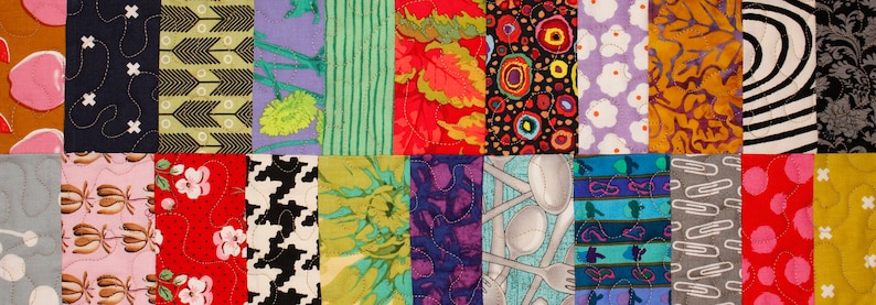 May include: A patchwork quilt with a variety of colorful fabrics and patterns. The quilt is made up of squares, each with a different design. Some of the patterns include flowers, geometric shapes, and abstract designs. The quilt is a vibrant and colorful piece of art.